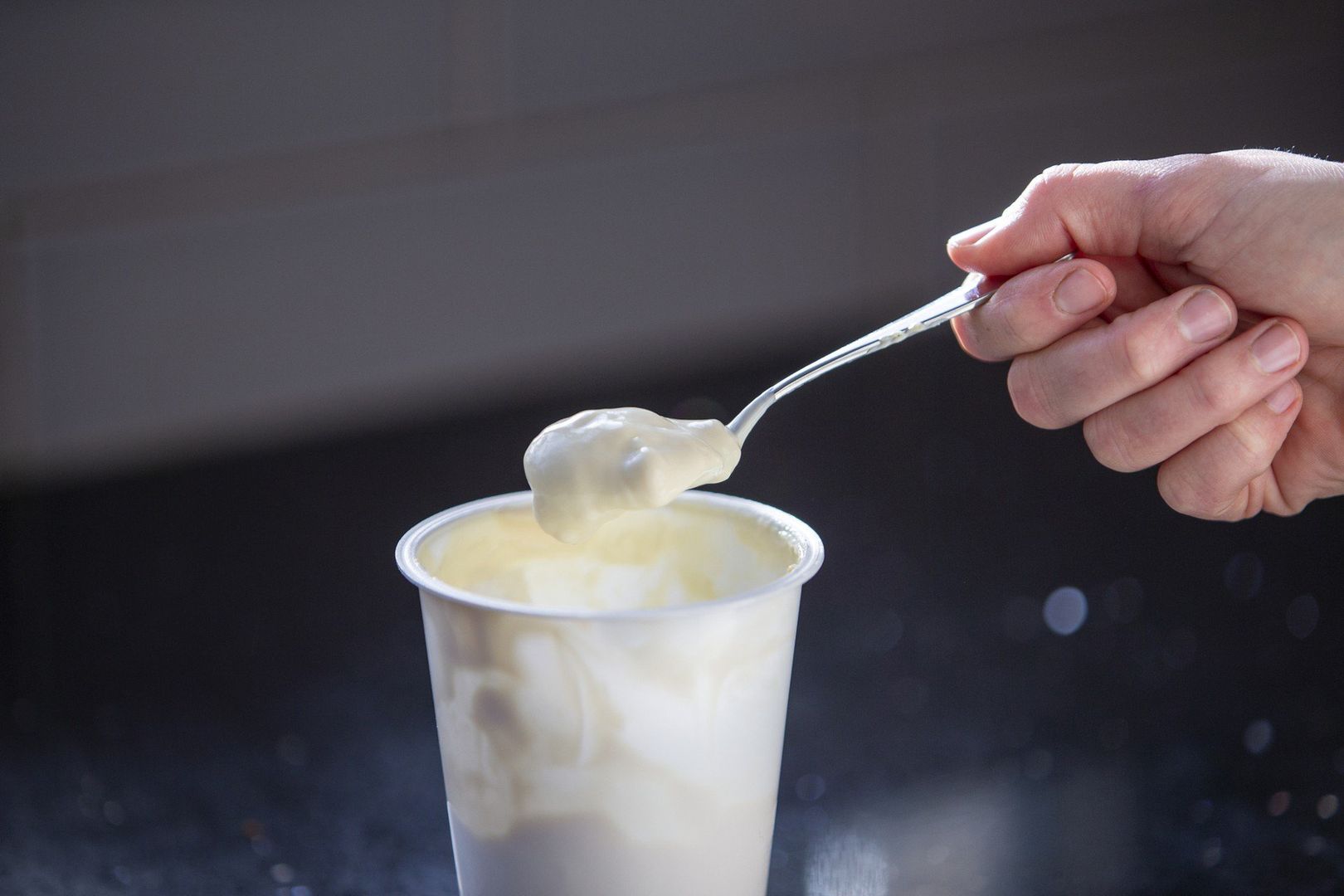 Eating Yoghurt out of a plastic yoghurt pot