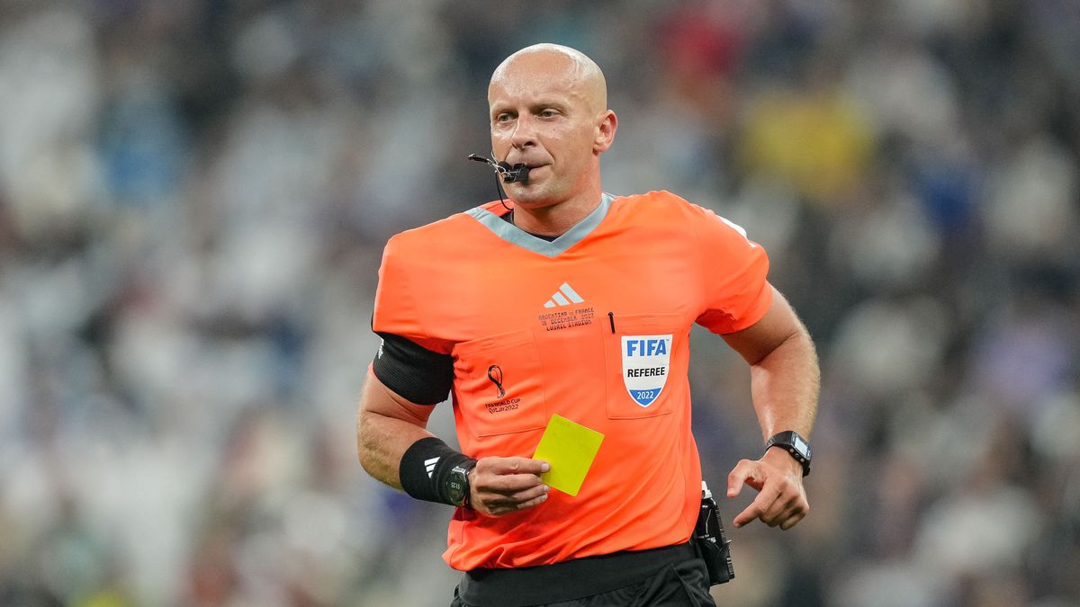 LUSAIL CITY, QATAR - DECEMBER 18: referee Szymon Marciniak of Poland the yellow card for Enzo Fernandez of Argentina during the FIFA World Cup Qatar 2022 Final match between Argentina and France at Lusail Stadium on December 18, 2022 in Lusail City, Qatar. (Photo by Mohammad Karamali/Defodi Images via Getty Images)