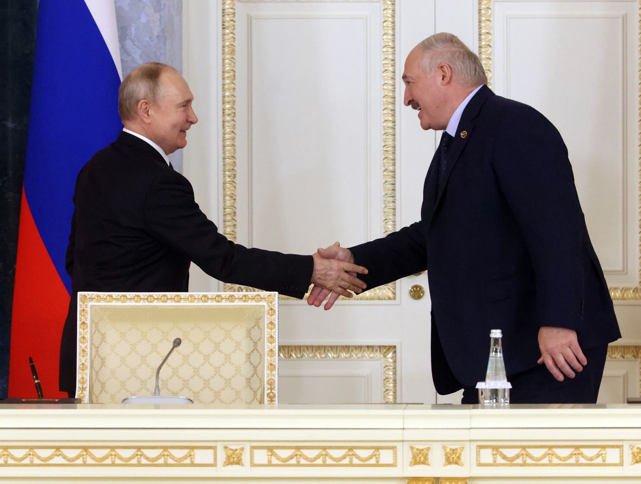 SAINT PETERSBURG, RUSSIA - JANUARY 29: (RUSSIA OUT) Russian President Vladimir Putin (L) and Belarussian President Alexander Lukashenko (L) smile during the plenary session of the Supreme Council of Russia and Belarus, at the Konstantin Palace on January 29, 2024, in Saint Petersburg, Russia. Belarussian President Lulashenko is having a three-days visit to Saint Petersburg. (Photo by Contributor/Getty Images)