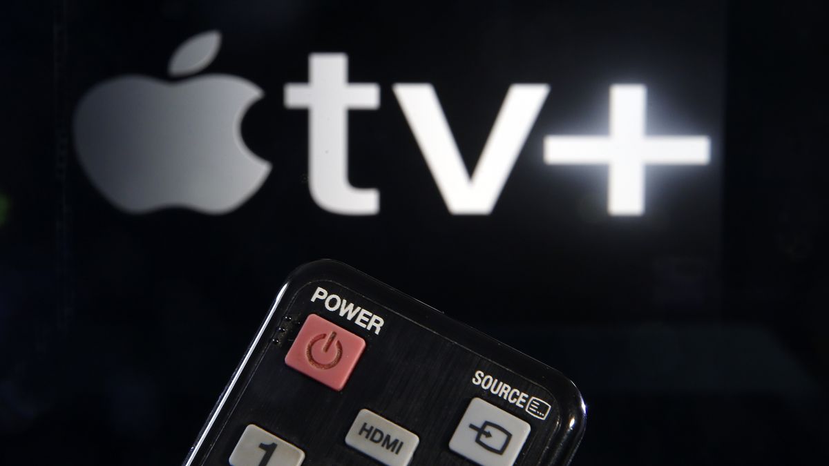 PARIS, FRANCE - MARCH 28: In this photo illustration, a remote control is seen in front of a television screen showing an Apple TV + logo on March 28, 2020 in Paris, France. (Photo by Chesnot/Getty Images)