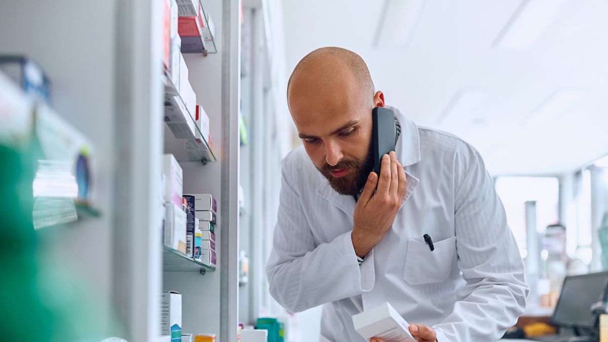 Yes, we have that medicine in our pharmacy!
Male pharmacist talking on the phone while looking for a medicine in drugstore.
Drazen Zigic
