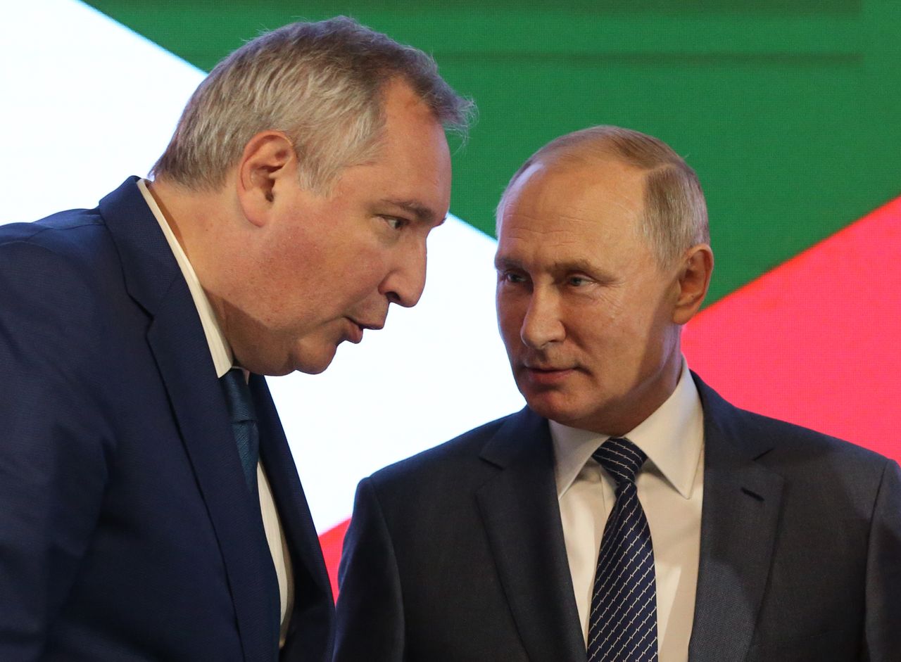 Russian President Vladimir Putin  talks to Roskosmos Space Agency Chief Dmitry Rogozin 