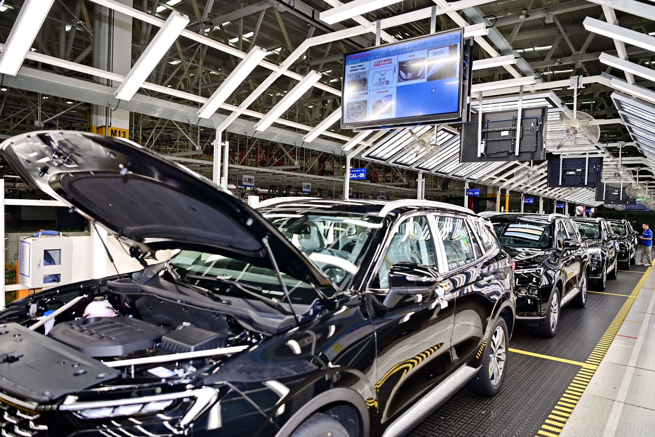 NANCHANG, CHINA - MAY 17: An employee works on the assembly line of electric vehicles in a digital automotive factory of Jiangling Motors on May 17, 2024 in Nanchang, Jiangxi Province of China. (Photo by Zhu Haipeng/VCG via Getty Images)