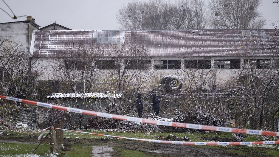 PRZEWODOW, POLAND - NOVEMBER 17, 2022: Police look for pieces of the missile near the explosion site in Przewodow, Poland, on November 17, 2022. (Photo by Karolina Jonderko/For the Washington Post)