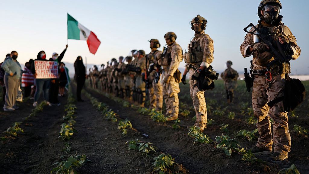 ICE Raid At Southern California Farm Sparks Protests
CAMARILLO, CALIFORNIA - JULY 10:  Federal agents and National Guard members block people protesting an ICE immigration raid at a nearby licensed cannabis farm on July 10, 2025 near Camarillo, California. Protestors stood off with federal agents for hours outside the farm in the farmworker community in Ventura County. A Los Angeles federal judge is set to rule Friday on a temporary restraining order which would restrict area immigration enforcement operations. (Photo by Mario Tama/Getty Images)
Mario Tama