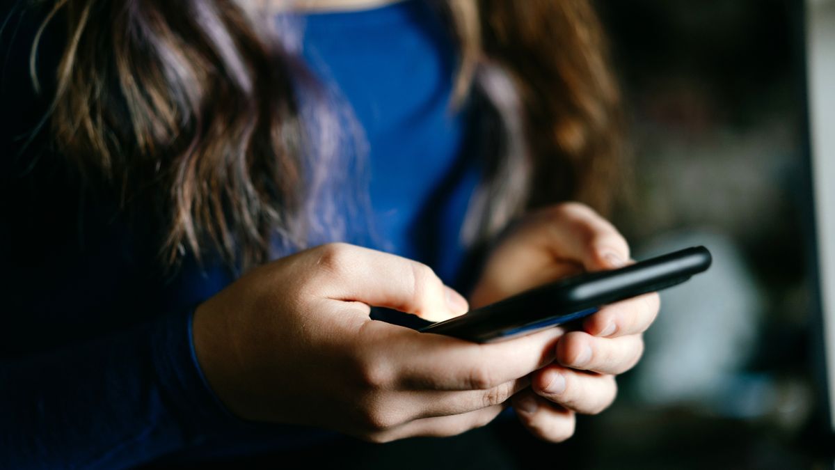 Close-Up of hands Holding a smartphone in casual setting
A focused view of individual's hands using a mobile phone indoors, conveying technology and communication concepts.
Fiordaliso