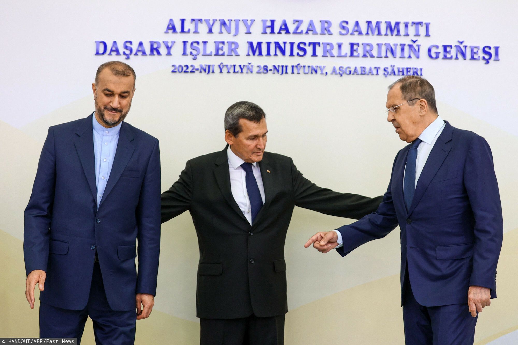 TemporaryA handout picture taken and released by the Russian Foreign Ministry press service shows Russian Foreign Minister Sergei Lavrov (R), Turkmenistan's Foreign Minister Rashid Meredov (C) and Iranian Foreign Minister Hossein Amir Abdollahian react during  annual Foreign ministers meeting of Caspian countries in Ashgabat on June 28, 2022. (Photo by Handout / RUSSIAN FOREIGN MINISTRY / AFP) / RESTRICTED TO EDITORIAL USE - MANDATORY CREDIT "AFP PHOTO / RUSSIAN FOREIGN MINISTRY" - NO MARKETING - NO ADVERTISING CAMPAIGNS - DISTRIBUTED AS A SERVICE TO CLIENTSHANDOUT