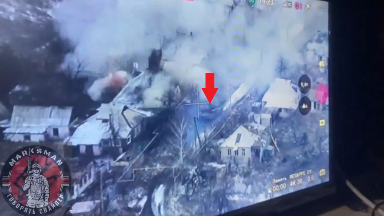 A Ukrainian tank cooperating with a drone and infantry during the clearing of buildings from Russians.
