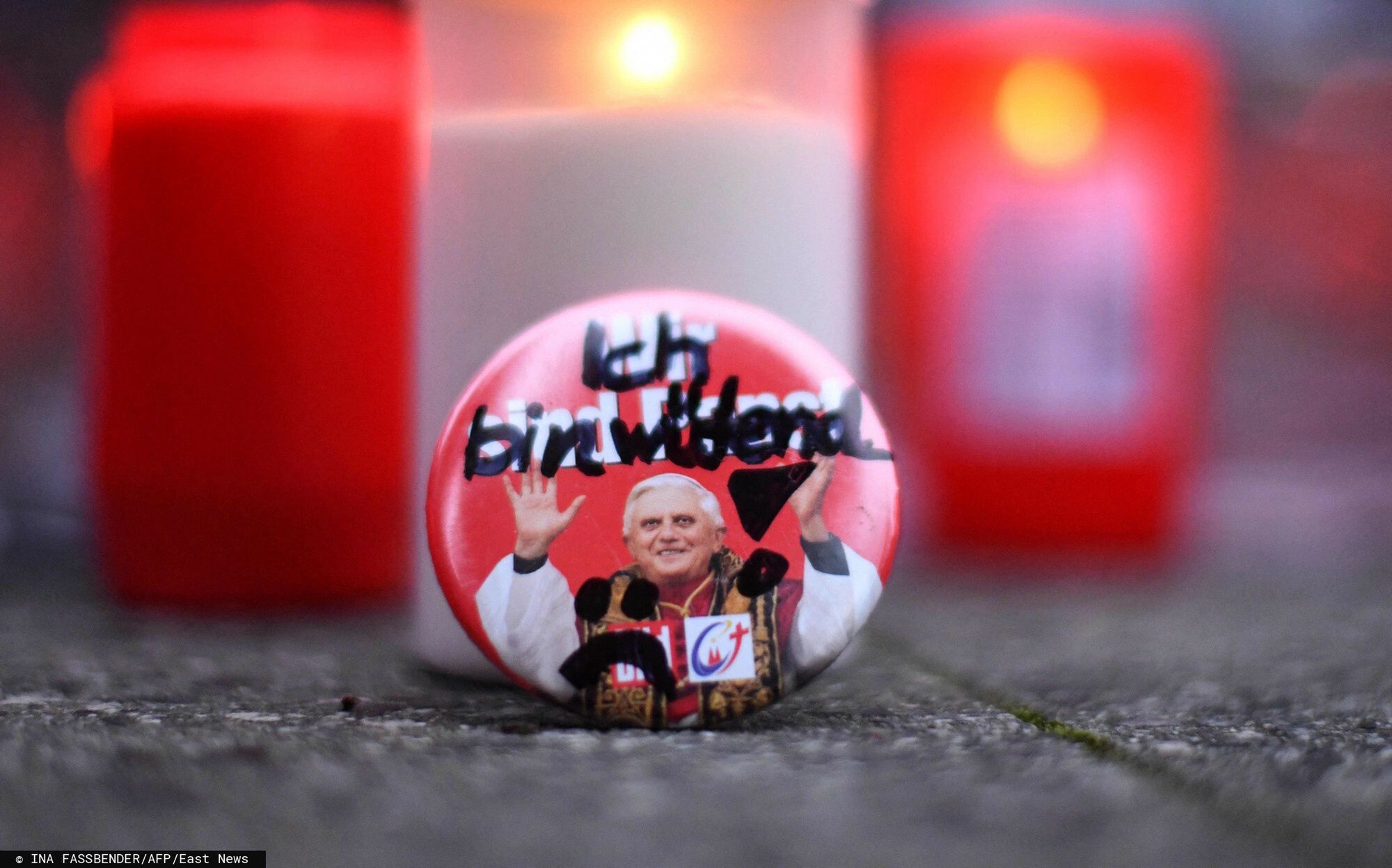 arch49(FILES) This file photo taken on January 21, 2022 shows a button showing former Pope Benedict XVI and with the lettering reading "I am angry" written over the printed lettering "We are Pope" during a silent protest against child abuse and cover-up strategies of church representatives at the cathedral of Essen, western Germany. - Former pope Benedict XVI on January 24, 2022 admitted providing incorrect information to a German inquiry about his presence at a 1980 meeting discussing a paedophile priest, blaming an editing "oversight". "He is very sorry for this mistake and asks to be excused," Benedict's personal secretary Georg Ganswein said in a statement cited by the KNA news agency and republished by Vatican News. (Photo by Ina FASSBENDER / AFP)INA FASSBENDER