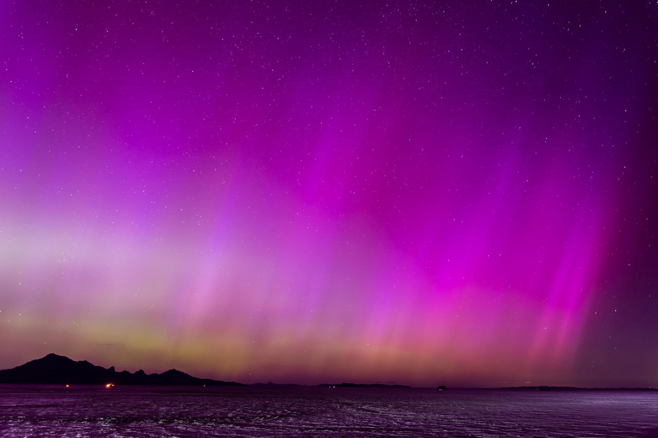 WENDOVER, UTAH - MAY 10: A geomagnetic storm lights up the night sky above the Bonneville Salt Flats on May 10, 2024 in Wendover, Utah. Places as far south as Alabama and parts of Northern California were expected to see the aurora borealis, also known as the northern lights from a powerful geomagnetic storm that reached Earth. (Photo by Blake Benard/Getty Images)