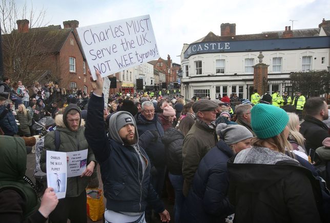 'Not My King Protest' In ColchesterCOLCHESTER, ENGLAND - MARCH 07: A Not My King protester holds a sign saying Charles Must Serve the UK, Not World Economic Forum (WEF) Tyranny as crowds gather to see King Charles III on March 7, 2023 in Colchester, England. (Photo by Martin Pope/Getty Images)Martin Pope