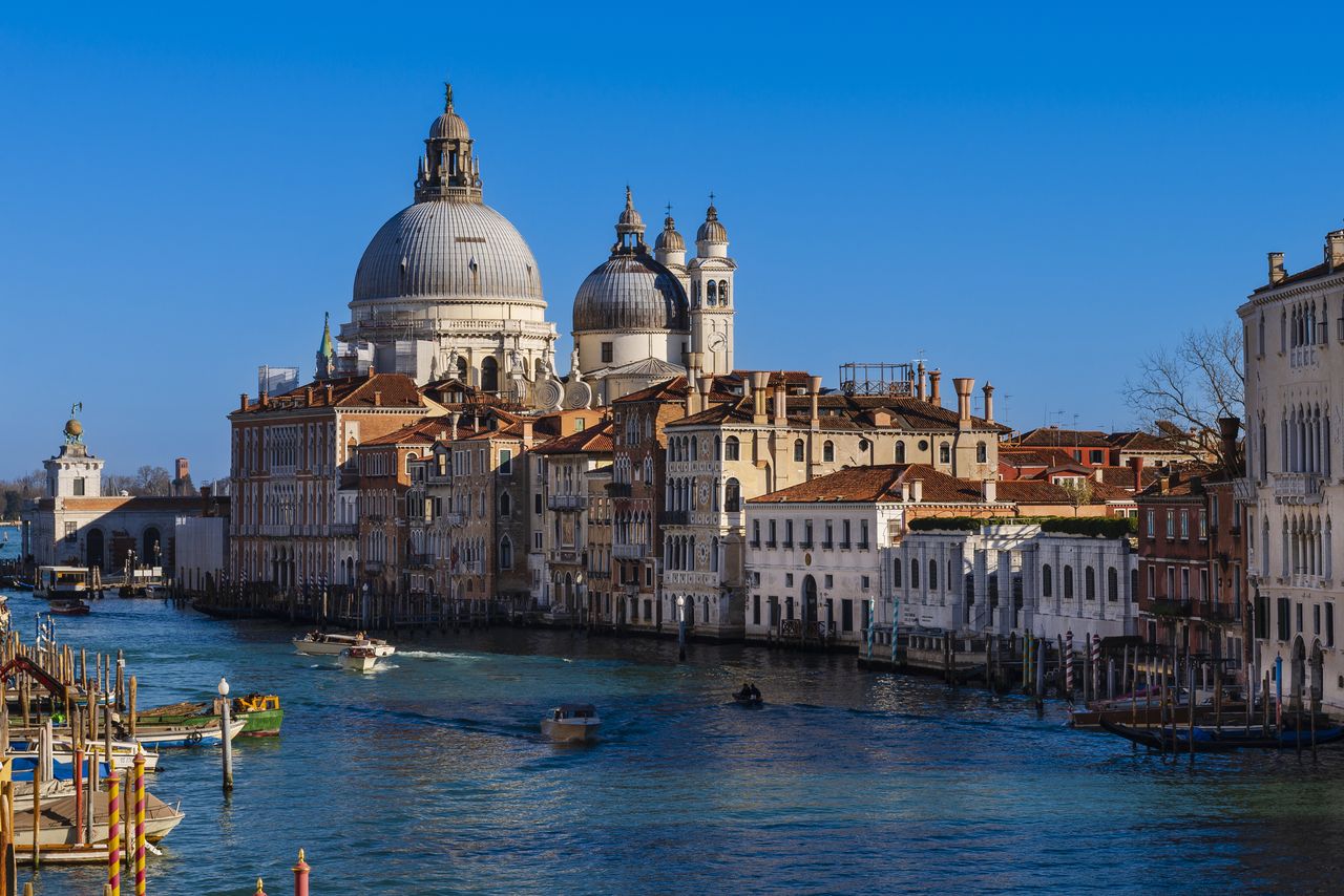 Santa Maria della Salute along the Grand Canal. Venice, Veneto, Italy. (Photo by: Alberto Biscaro/Design Pics Editorial/Universal Images Group via Getty Images)