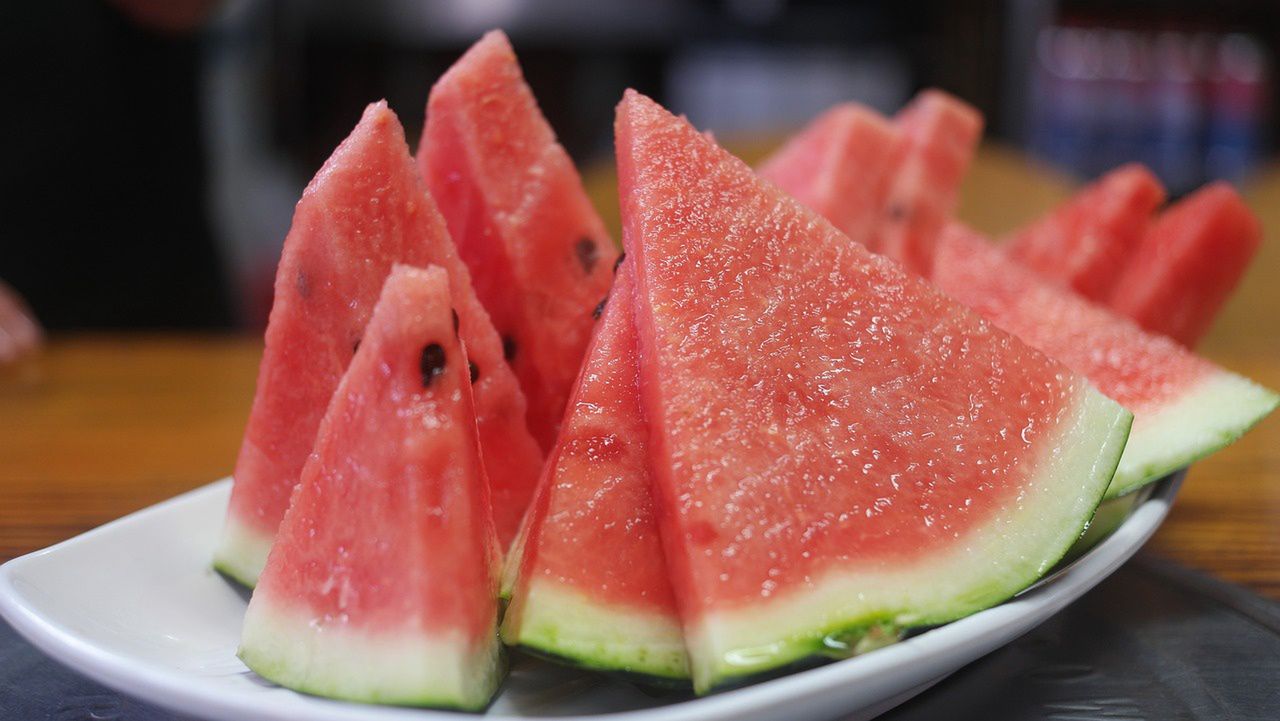 Why should watermelons be washed before consumption?