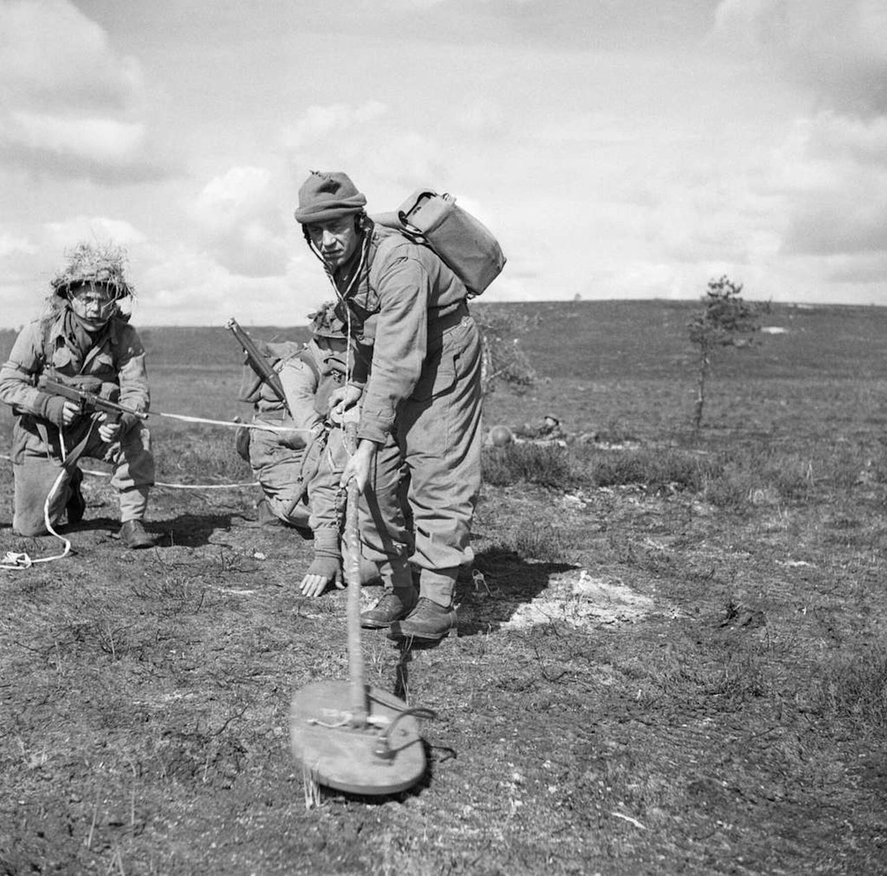 Soldiers during exercises with a mine detector