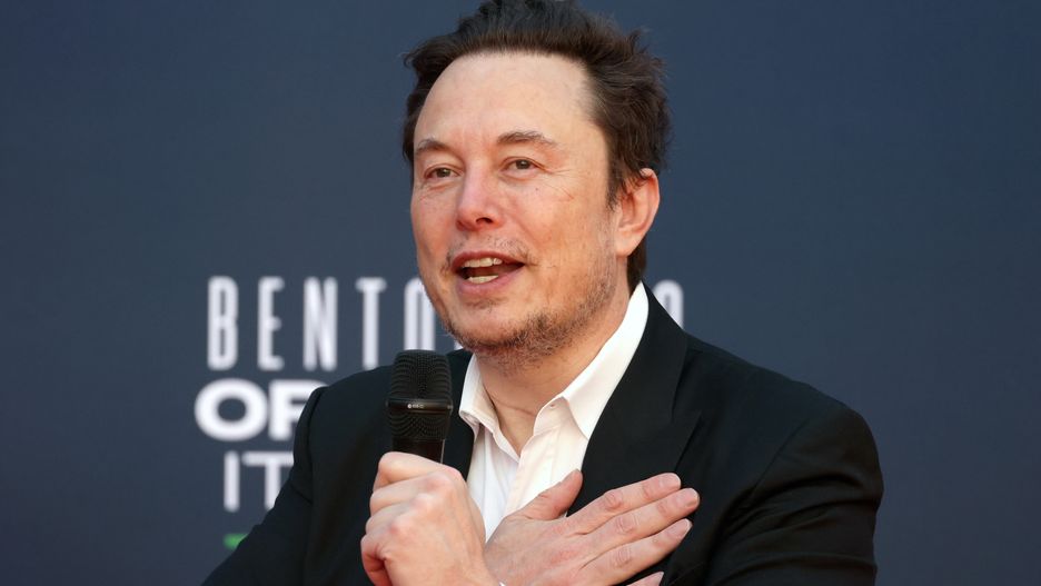 Elon Musk, chief executive officer of Tesla Inc., speaks with his hand on heart at the Atreju convention in Rome, Italy, on Saturday, Dec. 16, 2023. The annual event, organized by Giorgia Meloni's Brothers of Italy party, began in 1998 as a convention for right-wing youths and has evolved into a political kermesse, including ministers and members of the opposition. Photographer: Alessia Pierdomenico/Bloomberg via Getty Images
