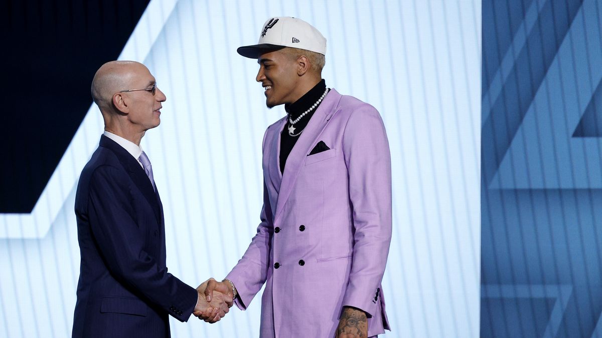 NEW YORK, NEW YORK - JUNE 23: NBA commissioner Adam Silver (L) and Jeremy Sochan pose for photos after Sochan was drafted with the 9th overall pick by the the San Antonio Spurs during the 2022 NBA Draft at Barclays Center on June 23, 2022 in New York City. NOTE TO USER: User expressly acknowledges and agrees that, by downloading and or using this photograph, User is consenting to the terms and conditions of the Getty Images License Agreement. (Photo by Sarah Stier/Getty Images)