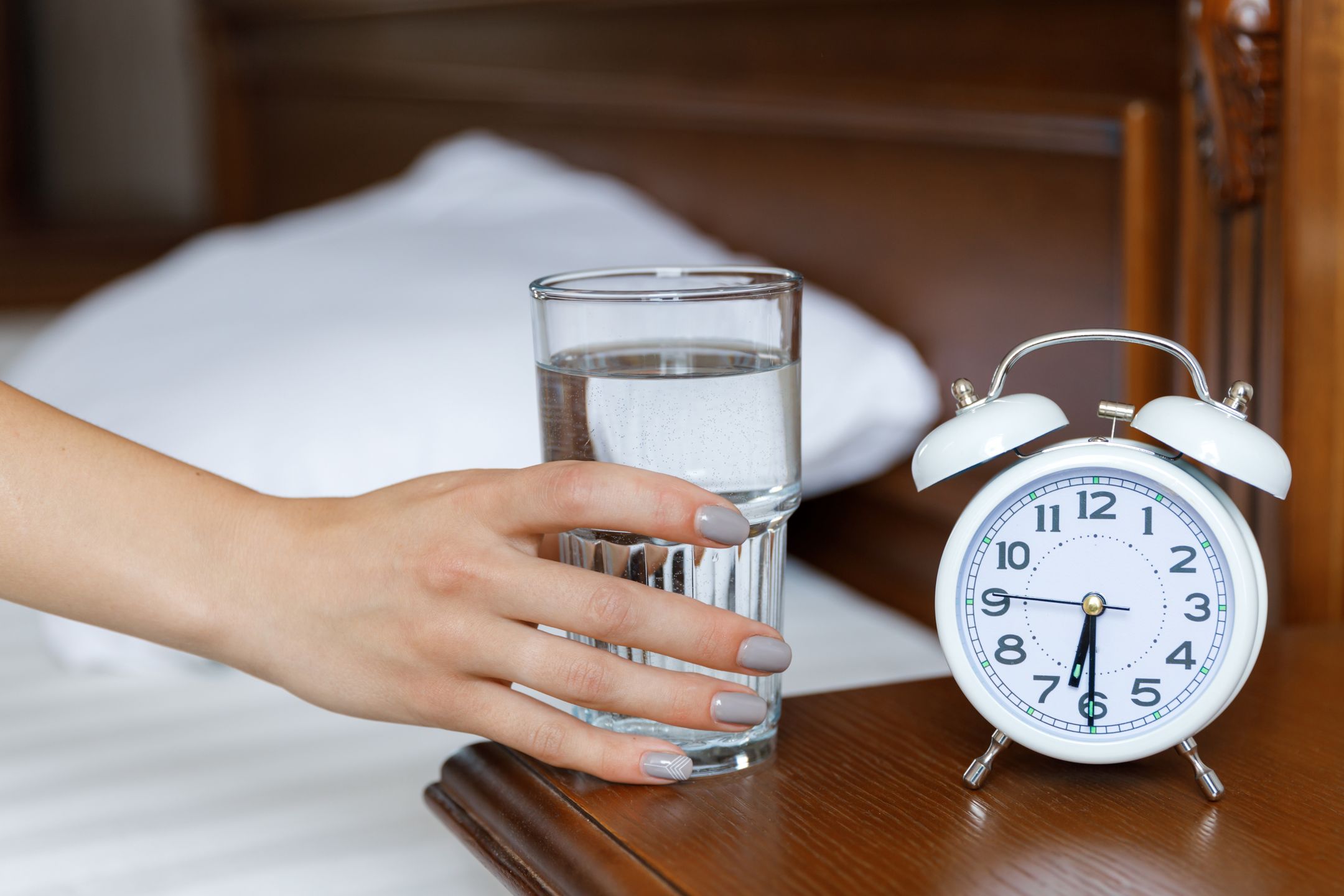 A white alarm clock and a glass of water are on a wooden bedside table. Morning. A woman stretches her hand to a glass of water
A white alarm clock and a glass of water are on a wooden bedside table. A woman stretches her hand to a glass of water
alarm, female, girl, morning, young, bed, clock, drink, glass, water, white, woman, concept, hand, healthy, holding, people, table, time, up, waking, adult, home, healthcare, hour, minute, number, awake, bedroom, blanket, caucasian, lifestyle, background, indoors, pull, take, wake up, sip, clear, arrows, action, daylight