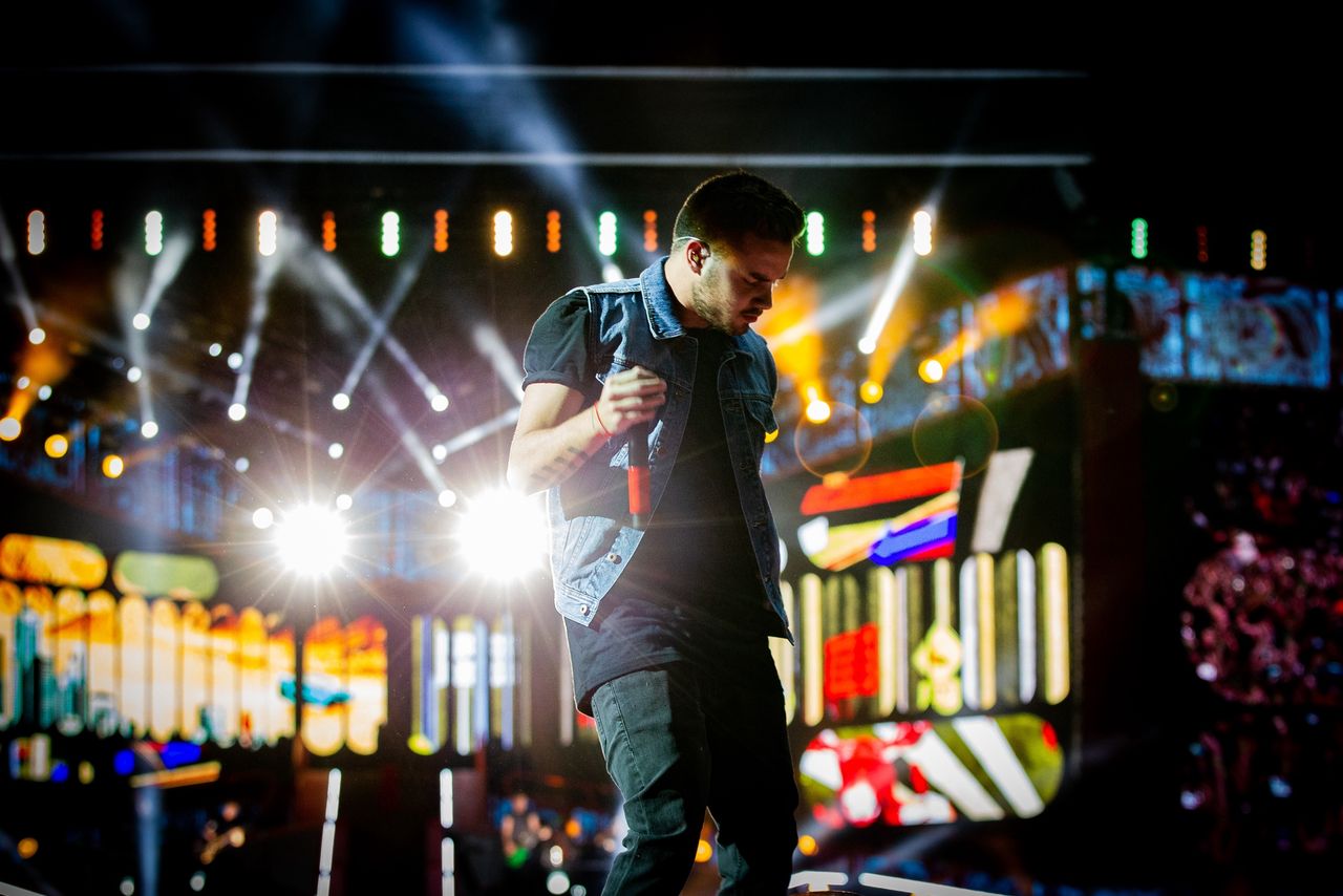 AMSTERDAM, NETHERLANDS - JUNE 24: Liam Payne of One Direction performs live on stage at Amsterdam Arena on June 24, 2014 in Amsterdam, Netherlands. (Photo by Paul Bergen/Redferns)