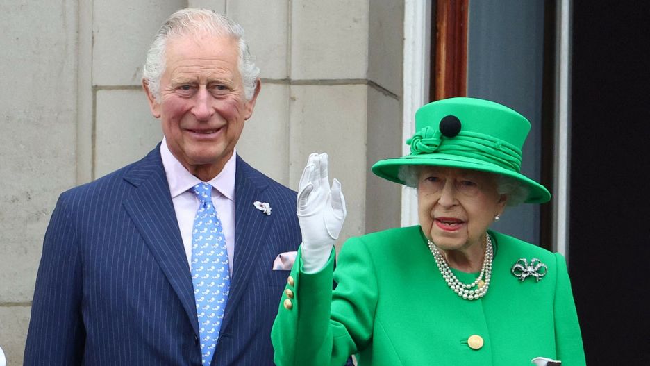 Temporary
(FILES) In this file photo taken on June 5, 2022 Britain's Queen Elizabeth II stands beside Britain's Prince Charles, Prince of Wales and waves to the public as she appears on Buckingham Palace balcony at the end of the Platinum Pageant in London. - Queen Elizabeth II, the longest-serving monarch in British history and an icon instantly recognisable to billions of people around the world, has died aged 96, Buckingham Palace said on Thursday, September 8, 2022.  Her eldest son, Charles, 73, succeeds as king immediately, according to centuries of protocol, beginning a new, less certain chapter for the royal family after the queen's record-breaking 70-year reign. (Photo by HANNAH MCKAY / POOL / AFP)
HANNAH MCKAY