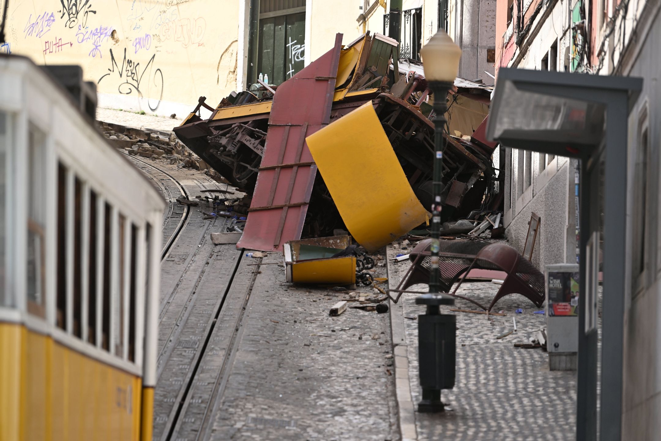 LISBON, PORTUGAL - SEPTEMBER 04: Rescuers and firefighters operate at the scene after the Gloria funicular cable railway derailed in Lisbon, Portugal, 04 September 2025. At least 17 died in the derailment, with emergency services reporting that 20 were injured and others are still trapped at the scene. (Photo by Zed Jameson/Anadolu via Getty Images)