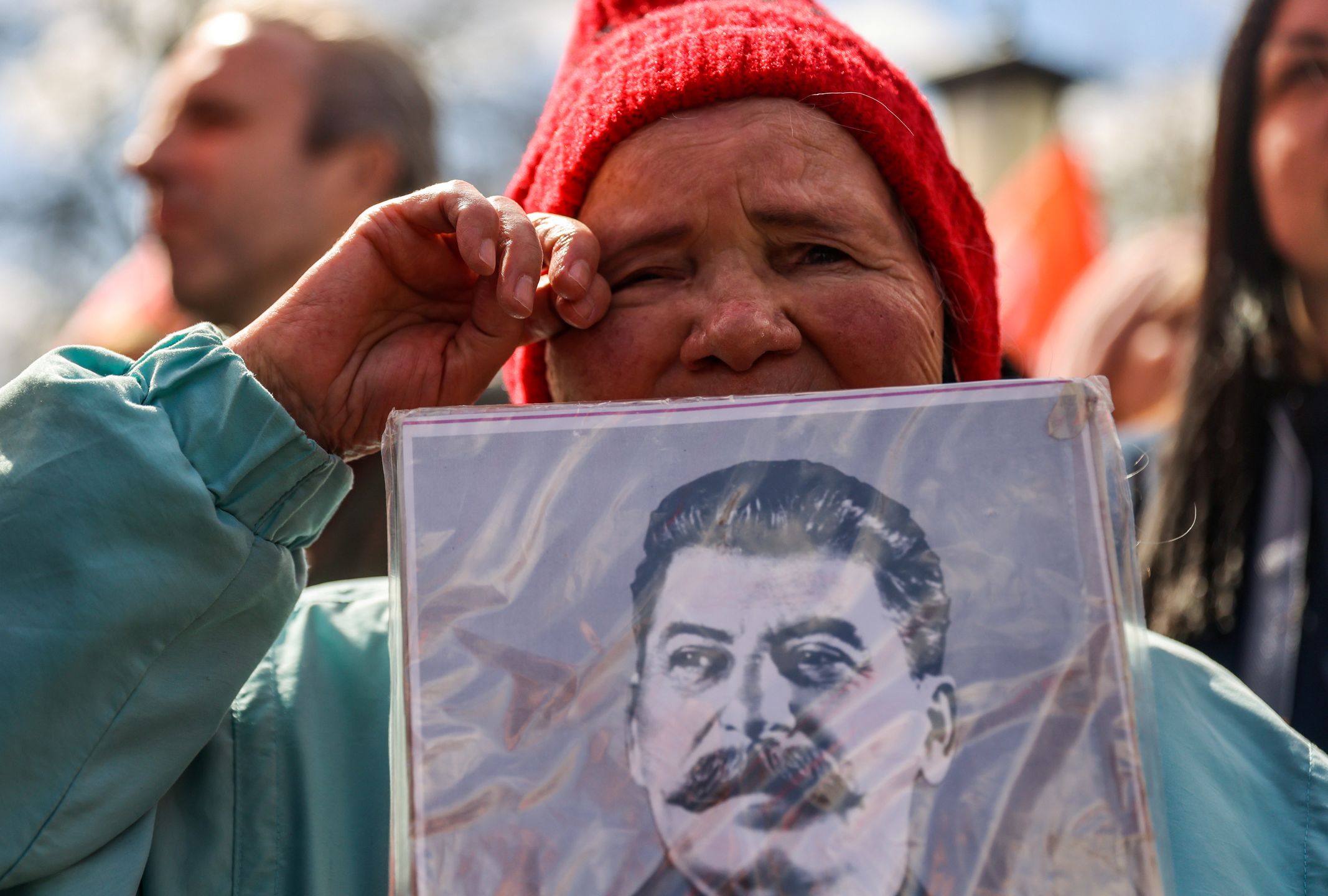 A supporter of Russia's Communist Party holds a portrait of Soviet leader Joseph Stalin during a May Day rally in Moscow, Russia May 1, 2022.