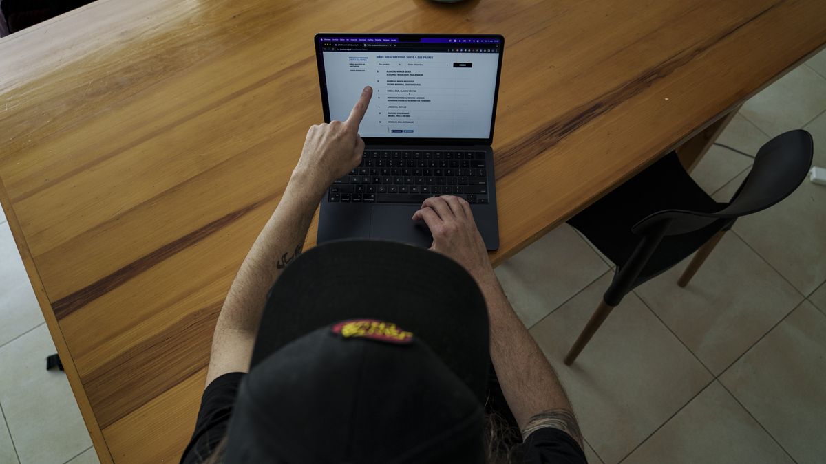 BUENOS AIRES, ARGENTINA - SEPTEMBER 16: Santiago Barrios, an Argentine art director, shows the list of people who disappeared in 1978 by the Argentine Military Dictatorship while working with artificial intelligence to visualize how babies stolen by the Argentine dictatorship during 1976-1983 period might look today in Buenos Aires, Argentina on September 16, 2023. Santiago Barros (art director and Abuelas de Plaza de Mayo contributor) combines the photos of the disappeared fathers and mothers pulled from a public database to create faces of what their children might look like as adults today. (Photo by Pablo Barrera/Anadolu Agency via Getty Images)