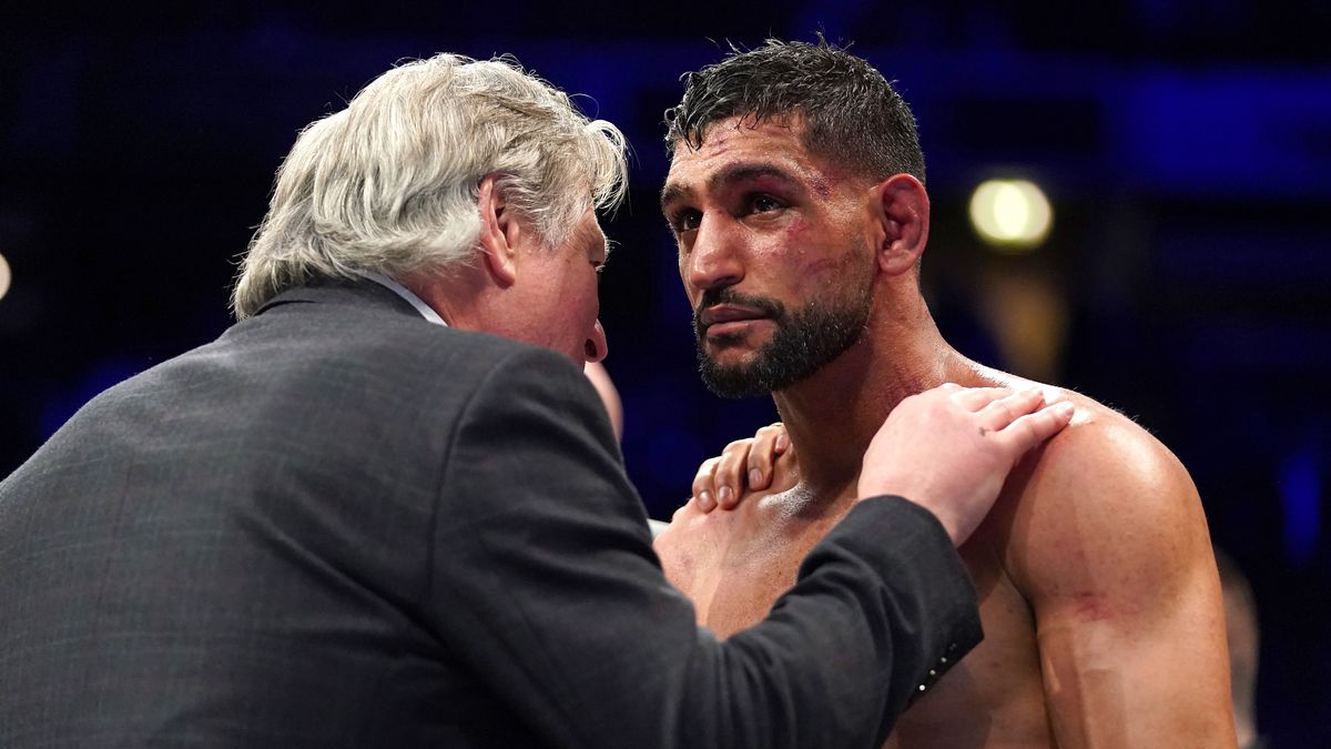 Amir Khan (right) speaks to BBBofC steward Robert W. Smith after losing the Welterweight Contest fight against Kell Brook at the AO Arena, Manchester. Picture date: Saturday February 19, 2022. (Photo by Nick Potts/PA Images via Getty Images)