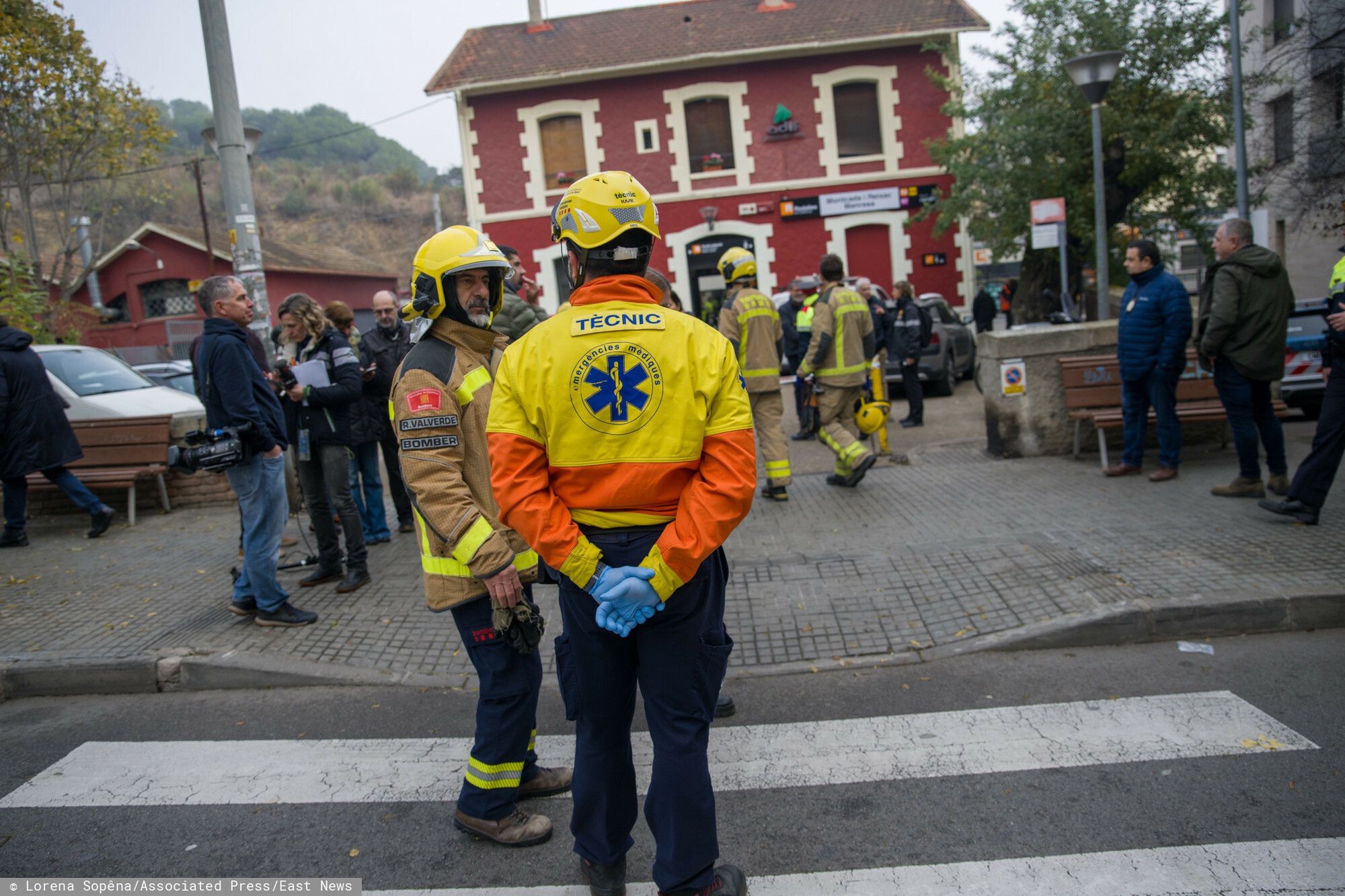 Temporary
A firefighter and an emergency medical technician talk outside the Montcada i Reixac station in Manresa after the collision of two trains, December 7, in Manresa, Barcelona, Catalonia (Spain). The number of people affected by the train crash at the Montcada i Reixac - Manresa station (Barcelona) amounts to 150 injured in a minor condition and five in a less serious condition. The circulation of trains on lines R4, R7 and R12 has been restored in both directions through a single track between Montcada Bifurcaci� and Terrassa (Barcelona). One hour after the crash the Generalitat's firefighters had already evacuated the convoy and no one was trapped. Civil Protection has activated the railway emergency plan of Catalonia (Ferrocat) in alert phase and Renfe has explained that the causes of the accident are being investigated. 07 DECEMBER 2022;MANRESA;BARCELONA;CATALUNYA;TRAIN CRASH;INJURIES Lorena Sop�na / Europa Press 12/07/2022 (Europa Press via AP)
Lorena Sop�na