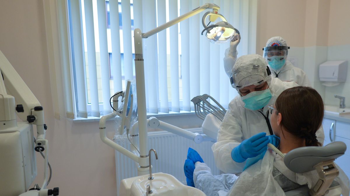 Dentistry During The Coronavirus Pandemic
A dentist and her assistant wearing PPE attend to a patient at Dentima Specialized Dental Center in Krakow.
On Friday, May 15, 2020, in Krakow, Poland. (Photo by Artur Widak/NurPhoto via Getty Images)
NurPhoto
a&amp;e, eu, editorial, krakow - poland, sars-cov-2, dental medicine, dental surgeon, dental technician, dentistry, diagnosis, emergency, face-to-face, gloves, hazmat suit, health, helmets, lockdown measures, medical, medical practice, oral cavity, oral medicine, protective mask, rewarding job, specialist