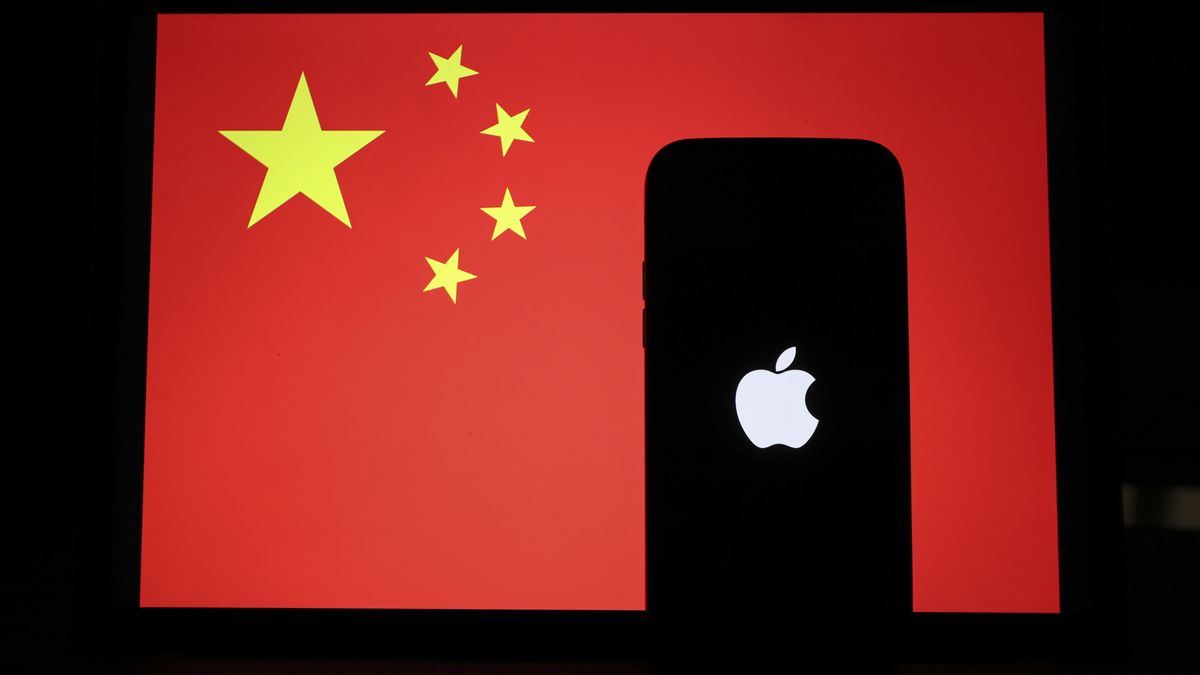 ANKARA, TURKIYE - JANUARY 31: In this photo illustration, the logo of Apple on a smartphone and the Chinese flag are displayed in Ankara, Turkiye on January 31, 2022. (Photo by Celal Gunes/Anadolu Agency via Getty Images)