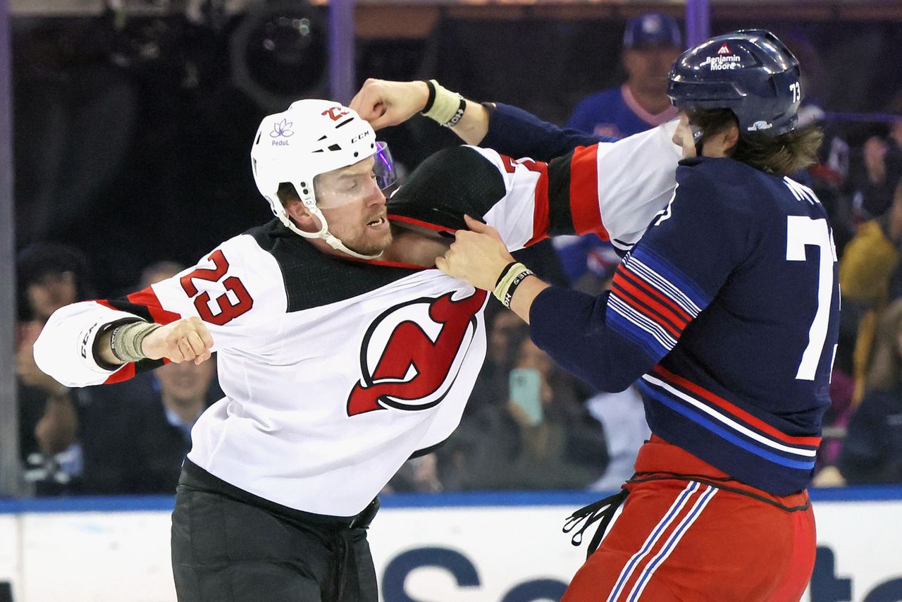 In the photo, battling Matt Rempe from New York Rangers and Kurtis MacDermid from New Jersey Devils.