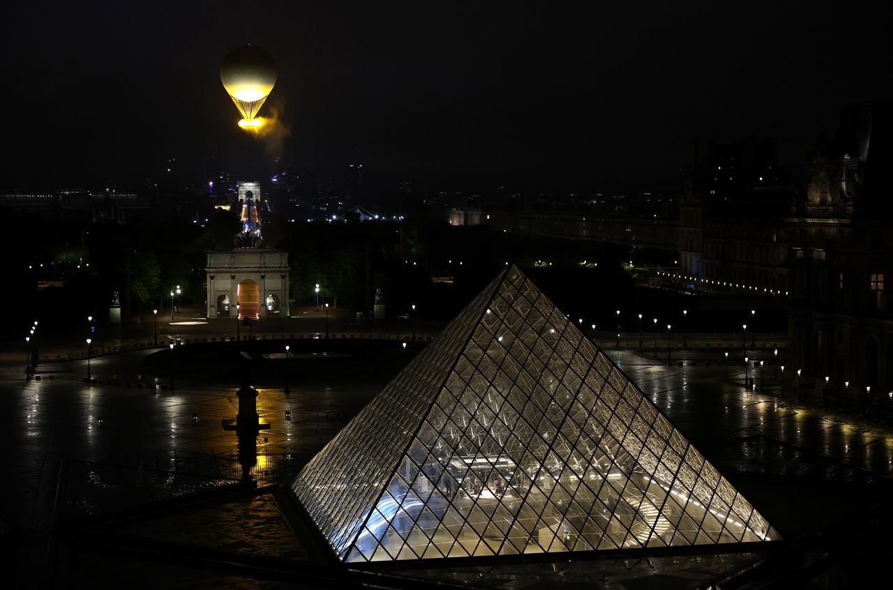 The Olympic flame during the opening ceremony of the Games. View from the Louvre