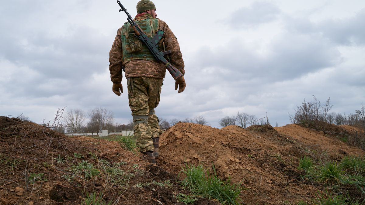 KHERSON, UKRAINE - JANUARY 07: A Ukrainian soldier stands guard in a trench as the Territorial Defense of Kherson reinforce their positions on January 7, 2023 in Kherson, Ukraine. President of the Russian Federation Vladimir Putin declared a unilateral Orthodox Christmas ceasefire from January 6, 12 PM to January 7 midnight. Kherson was the only regional capital captured by Russia since the invasion and it was liberated by Ukraine last month. (Photo by Pierre Crom/Getty Images)