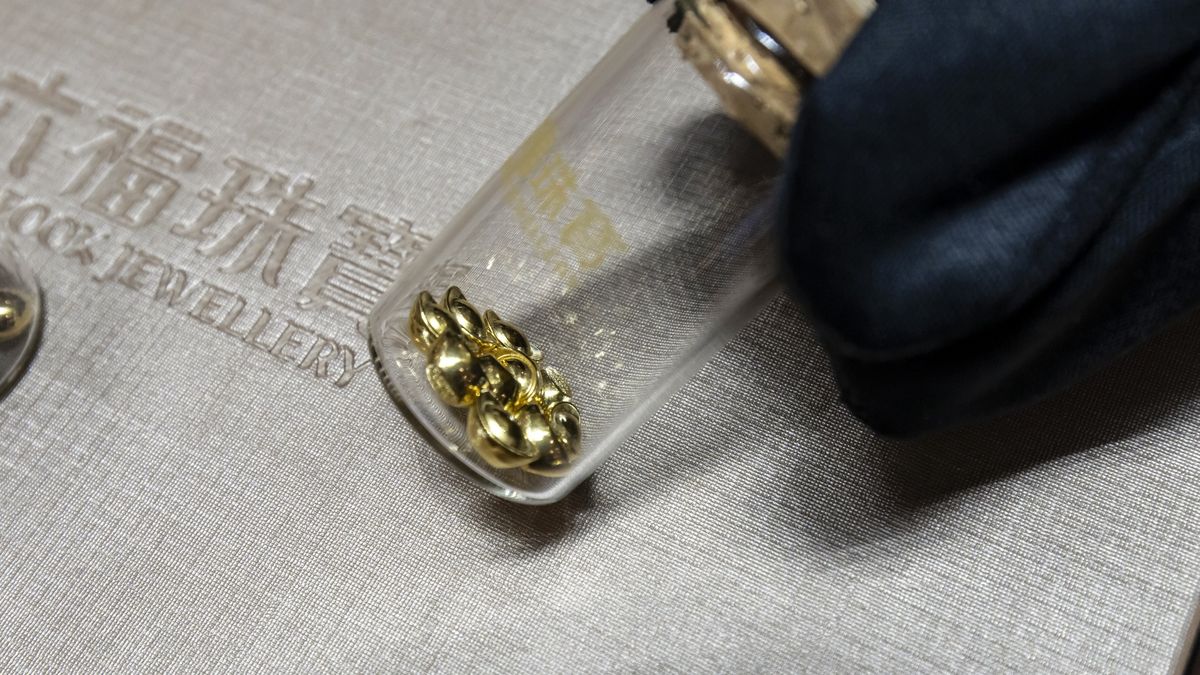 Gold beans for sale inside a Luk Fook Holdings International Ltd. jewelry store in Shanghai, China, on Wednesday, March 13, 2024. Weighing as little as one gram, the beans  and other forms of gold jewelry  are increasingly viewed as the safest investment bet for young Chinese in an era of economic uncertainty. Photographer: Qilai Shen/Bloomberg via Getty Images