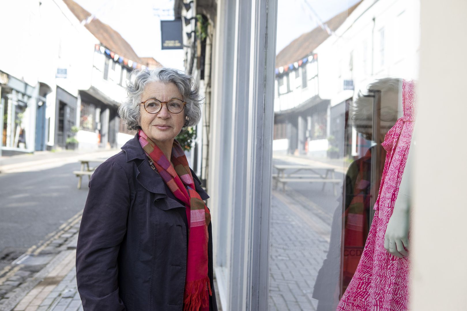 Woman standing outside a shop window in an old English town
Part of a series - Adults having a fun day out together in St Albans, England
Peter Carruthers