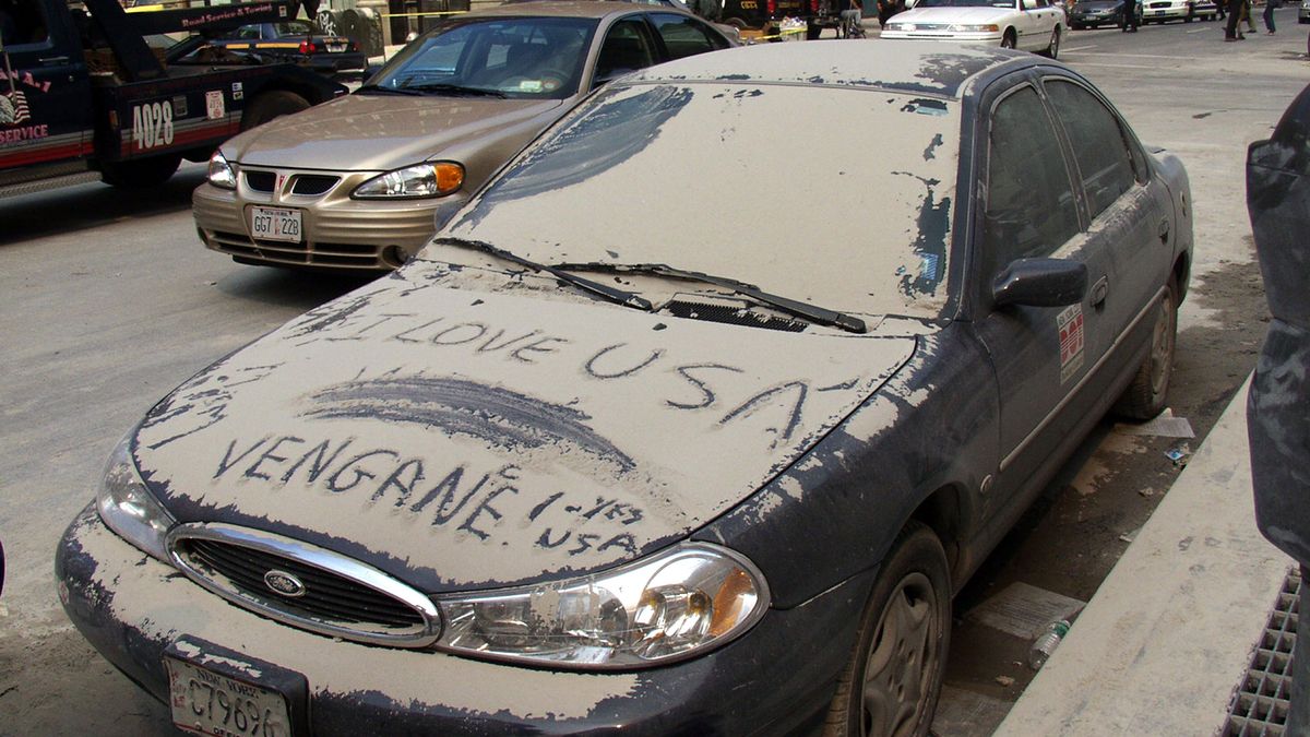 World Trade Center Terrorist Attack - Ground Zero
Message left in the dust on a parked car reveals devotion to the USA. (Photo by Hiro Oshima/WireImage) *** Local Caption ***
Hiro Oshima