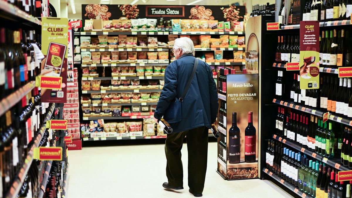 Bottles of wine for sale inside a grocery store in Lisbon, Portugal, on Friday, April 11, 2025. Trump's tariffs are causing a slowdown in global trade, with companies pausing orders and reducing production due to uncertainty and increased costs. Photographer: Zed Jameson/Bloomberg via Getty Images