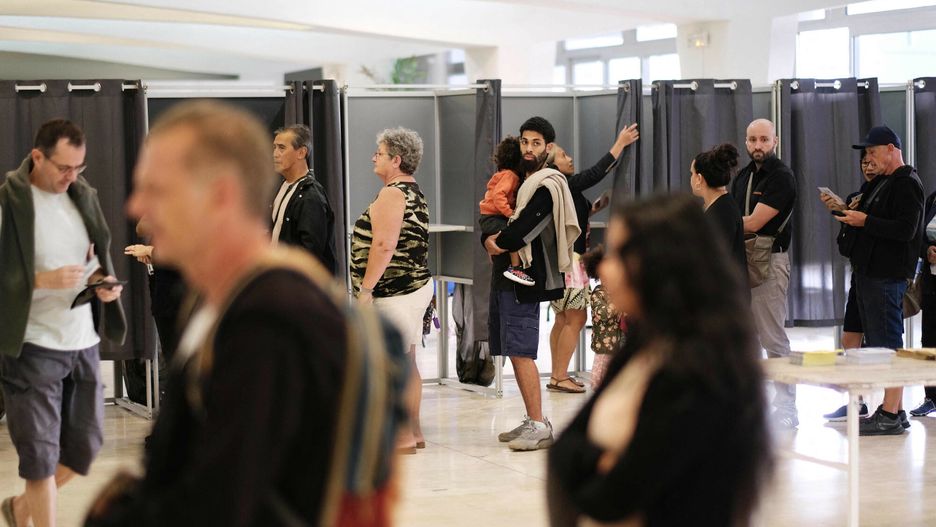 Temporary
Voters queue at a polling station at the Hotel de Ville (city hall) in Noumea, in the French Pacific territory of New Caledonia, on July 7, 2024, during the second round of France's legislative elections. France on July 6 prepared for its most consequential legislative election of recent times, with residents of overseas territories opening voting for a poll expected to give the far right its biggest ever presence in parliament. (Photo by Theo Rouby / AFP)
THEO ROUBY