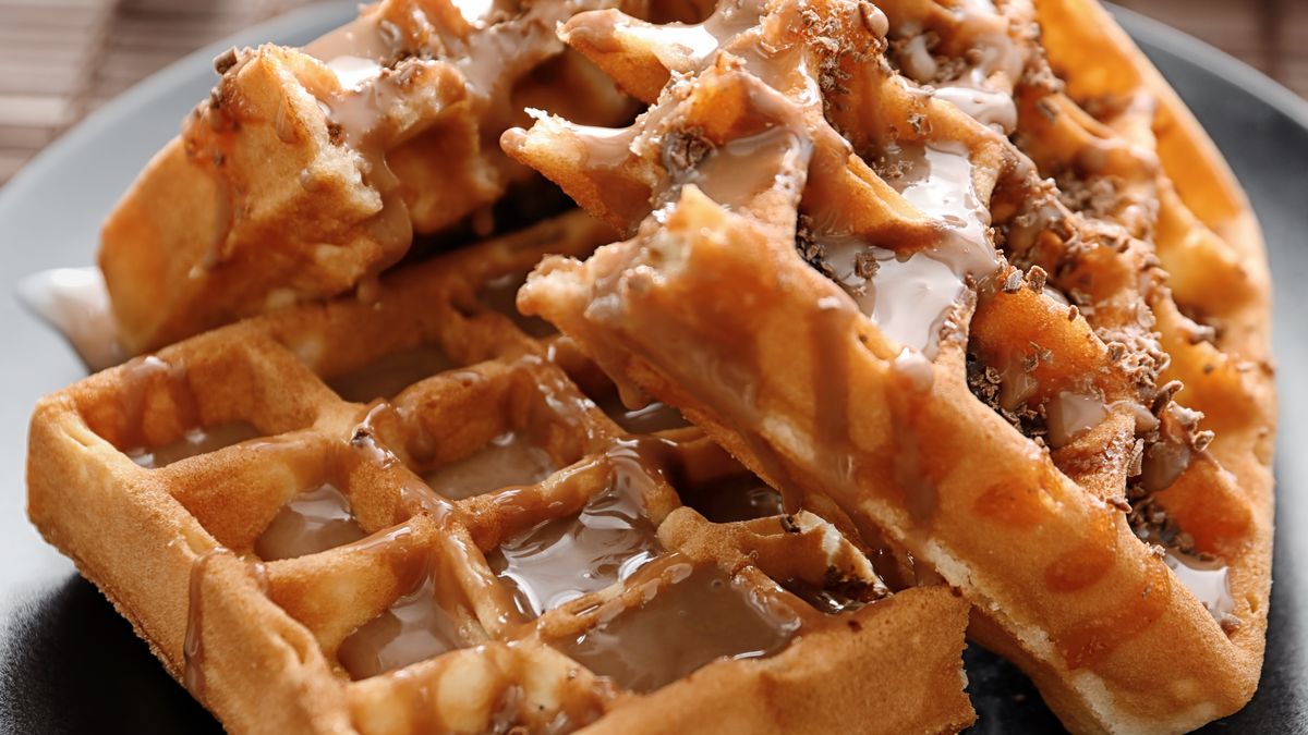 Tasty waffles and caramel topping on plateappetizing, background, baked, bakery, belgian, belgic, black, breakfast, broken, caramel, chocolate, color, cooked, cuisine, delicious, dessert, eat, flavor, food, fresh, grated, homemade, ingredient, leaves, meal, mint, natural, nutrition, object, pastry, pieces, plate, product, recipe, snack, sugar, sweet, syrup, table, taste, tasty, topping, treat, wafers, waffles, appetizing, background, baked, bakery, belgian, belgic, black, breakfast, broken, caramel, chocolate, color, cooked, cuisine, delicious, dessert, eat, flavor, food, fresh, grated, homemade, ingredient, leaves, meal, mint, natural, nutrition, object, pastry, pieces, plate, product, recipe, snack, sugar, sweet, syrup, table, taste, tasty, topping, treat, wafers, waffles
