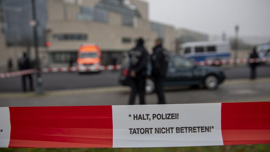 BERLIN, GERMANY - NOVEMBER 25: Police stands next to a car that crashed into the gate of German Chancellery stands outside on November 25, 2020 in Berlin, Germany. Police detained a man who drove the car into the gate of the German chancellery in central Berlin in what appeared to be a protest. The chancellery is set back from main roads and no injuries were reported. (Photo by Maja Hitij/Getty Images)