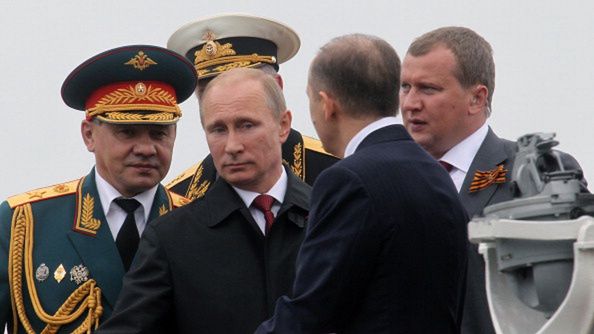 SEVASTOPOL, CRIMEA - MAY 9:  Russian President Vladimir Putin (C) and Defence Minister Sergei Shoigu (L) attend a Victory Day parade May 9, 2014 in Sevastopol, a city in the Crimean Peninsula whose status is under dispute between Russia and Ukraine. Putin was visiting the disputed area for the first time since its annexation from Ukraine by Russia. Victory Day marks the defeat of Nazi Germany.  (Photo by Sasha Mordovets/Getty Images)
Sasha Mordovets