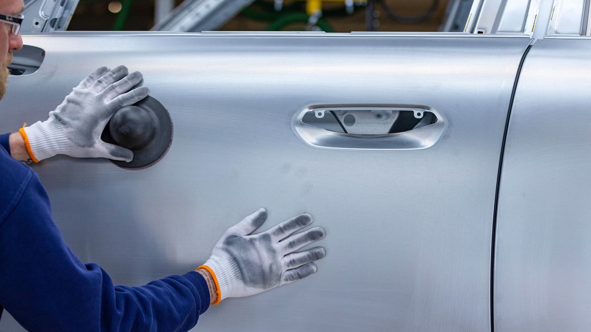 A worker inspects the body of a Mini Countryman automobile at the bodyshop in the BMW Group factory in Leipzig, Germany, on Thursday, March 21, 2024. New-vehicle registrations rose to 995,059 units last month, the European Automobile Manufacturers' Association said Thursday. Photographer: Krisztian Bocsi/Bloomberg via Getty Images