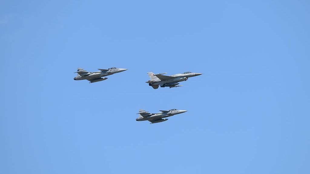 Poland's National Armed Forces Day Military Parade.
A Polish air force F-16 is flanked on either side by Saab JAS-39 Gripen fighter jets as they perform a flyover during National Army Day in Warsaw, Poland, on August 15, 2025. Thousands of members of the Polish armed forces take part in the Armed Forces Day military parade that takes place annually on August 15 to commemorate Poland's victory over the Soviet Union's army in 1920. (Photo by Aleksander Kalka/NurPhoto via Getty Images)
NurPhoto
warsaw parade, august 15, soviet-polish war, military aviation, fly-over, commemorate, jas39, military commemoration, aleksander kalka, government and politics, spending, victory, defense, historical event, soviet union, polish armed forces, f16, national army day, gripen, nurphoto, aerial display, polish victory, fighter jets, polish airforce, aviation display, warszawa, f-16, national pride., saab jas-39 gripen, polska, national day