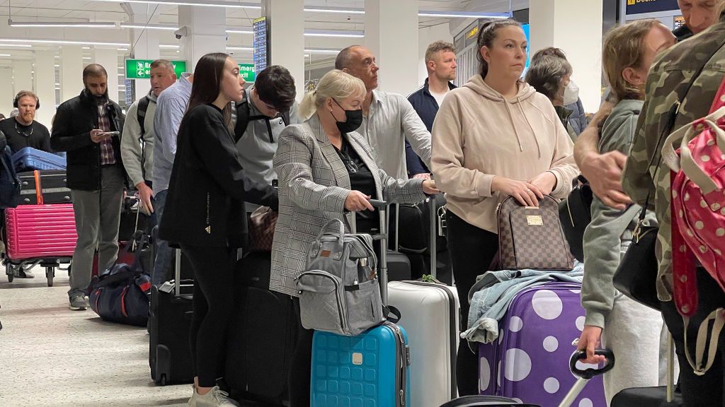 UK Tourists Face Easter Getaway Travel IssuesMANCHESTER, UNITED KINGDOM - APRIL 05: Passengers queue for check in at Manchester Airport's terminal 1 on April 05, 2022 in Manchester, United Kingdom. Covid checks, high passenger volumes and staff shortages due to illness have meant longer than usual check-in times at many airports around the UK. (Photo by Christopher Furlong/Getty Images)Christopher Furlong