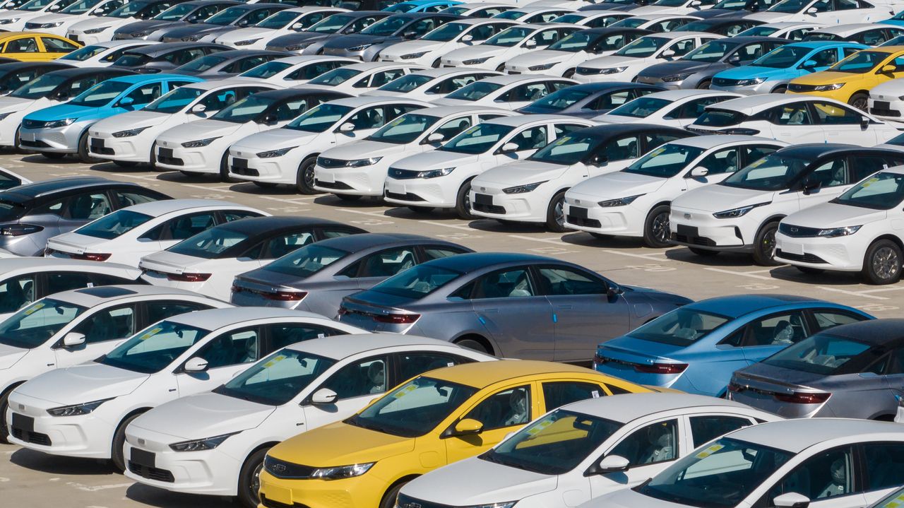 Bird's eye view of new electric cars parked in the factory parking lot of Geely in Jinzhong, central China