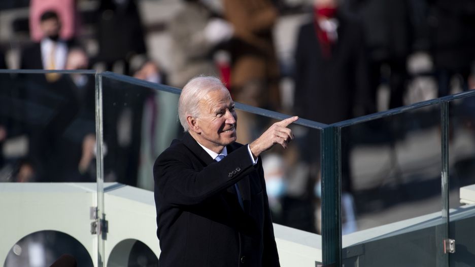 UNITED STATES - January 20: President Joe Biden points to guests attending the Inauguration ceremony after he is sworn in as the 46th President of the United States by Supreme Court Chief Justice John Roberts on the West Front of the Capitol on Wednesday, Jan. 20, 2021. (Photo by Caroline Brehman/CQ-Roll Call, Inc via Getty Images)