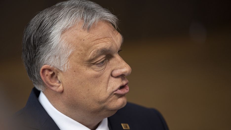 Viktor Orban Prime Minister of Hungary arrives at the special EU summit, walking next to the European flags behind the flag of Europe and talks to the media about the Russian sanctions. Special Meeting of the EU leaders, the European Council in Brussels, Belgium on May 30, 2022 (Photo by Nicolas Economou/NurPhoto via Getty Images)