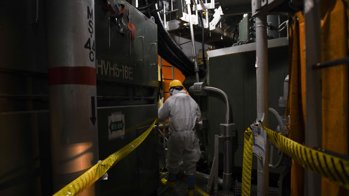 A worker wearing protective suits inside the reactor in Unit 5, which has a structure similar to Unit 2 where fuel debris removal is planned, at the Fukushima Dai-ichi Nuclear Power Plant, in Okuma, Fukushima Prefecture, Japan, on Thursday, Feb. 5, 2026. Fifteen years ago this week, Japan faced the biggest nuclear meltdown since the 1986 Chernobyl disaster. Photographer: Noriko Hayashi/Bloomberg via Getty Images