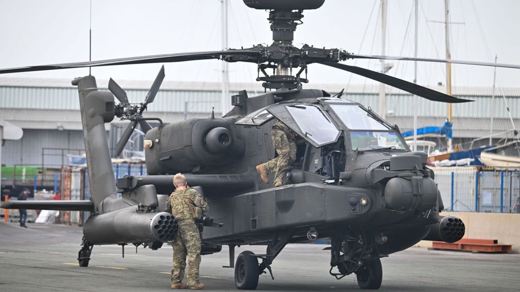 UK Daily Life 2022
PORTLAND, ENGLAND - DECEMBER 13: A British Army AgustaWestland Apache Attack Helicopter is seen after landing at Portland heliport, on December 13, 2022 in Portland, United Kingdom. (Photo by Finnbarr Webster/Getty Images)
Finnbarr Webster