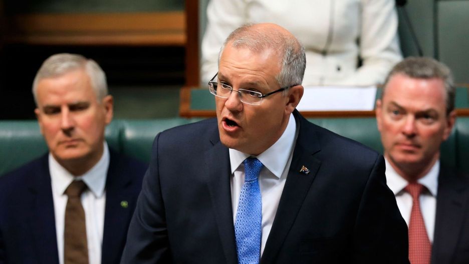 arch32TOPSHOT - Australia's Prime Minister Scott Morrison (C) delivers a national apology to child sex abuse victims in the House of Representatives in Parliament House in Canberra on October 22, 2018. - Morrison issued a national apology to victims of child sex abuse in an emotional address to parliament October 22, acknowledging the state failed to stop "evil dark crimes" committed over decades. (Photo by Sean Davey / AFP)SEAN DAVEY
